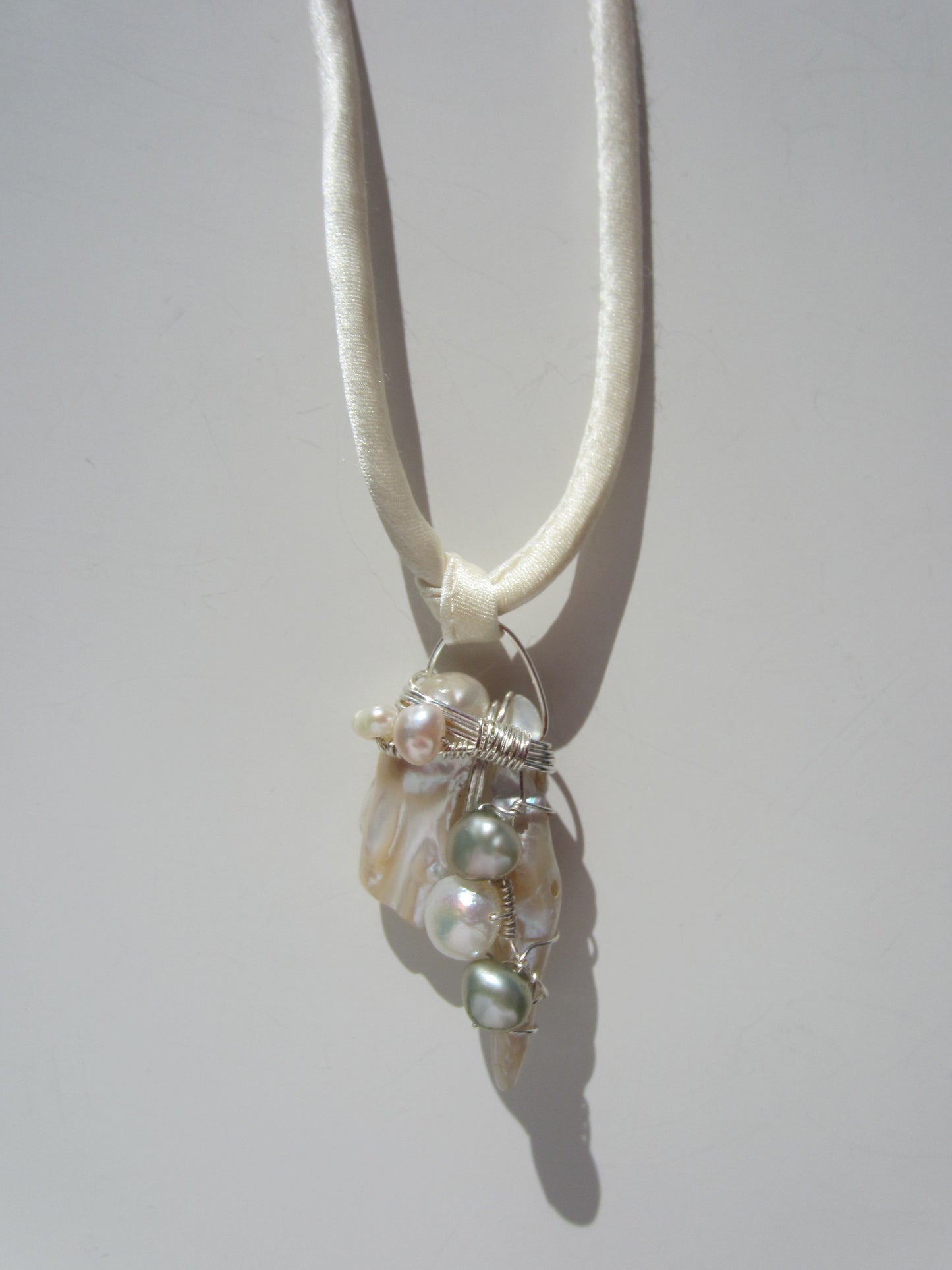 pearl tooth pendant